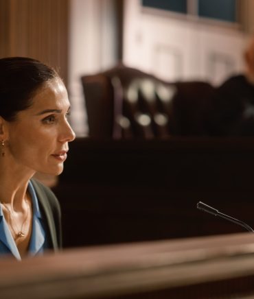 Court of Law and Justice: Portrait of Beautiful Female Victim Giving Heartfelt Testimony to Judge, Jury. Emotional Speech of Empowered Woman against Crime, Injustice, Prejudice, Corruption